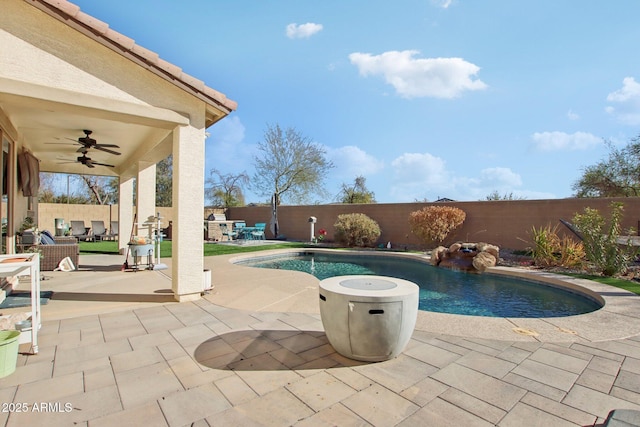 view of pool featuring ceiling fan and a patio area