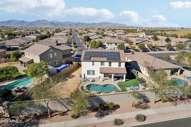 birds eye view of property with a mountain view