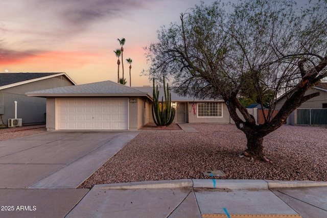 1055 E Ingram St, Mesa, AZ 85203 - ranch-style house featuring a garage, driveway, and stucco siding
