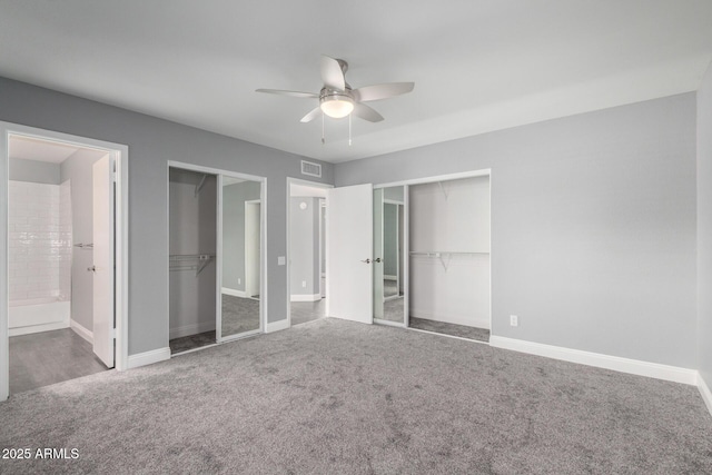 1055 E Ingram St, Mesa, AZ 85203 - unfurnished bedroom with multiple closets, carpet flooring, ensuite bathroom, and ceiling fan