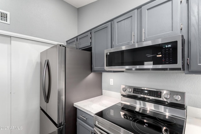 1055 E Ingram St, Mesa, AZ 85203 - kitchen with stainless steel appliances and gray cabinets