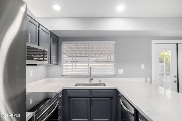 1055 E Ingram St, Mesa, AZ 85203 - kitchen featuring appliances with stainless steel finishes, recessed lighting, light stone countertops, gray cabinetry, and a peninsula