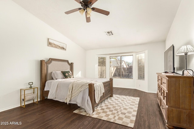 bedroom with dark wood-type flooring, ceiling fan, and vaulted ceiling