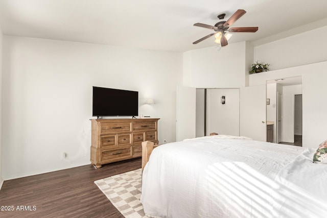 bedroom featuring vaulted ceiling, dark hardwood / wood-style floors, and ceiling fan