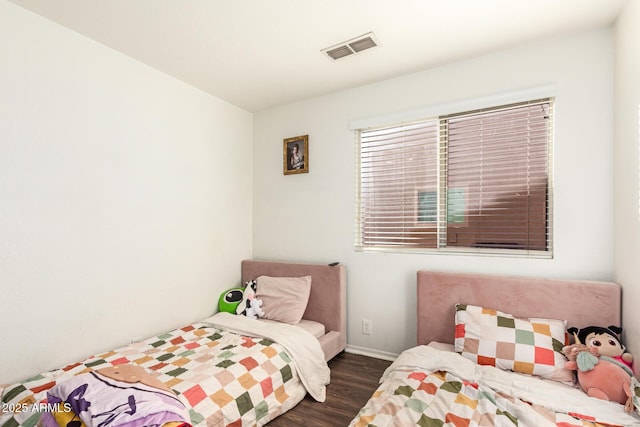 bedroom featuring dark hardwood / wood-style floors