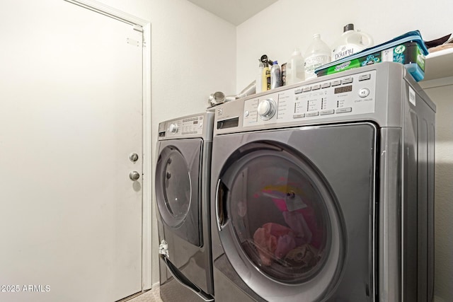 laundry room featuring independent washer and dryer