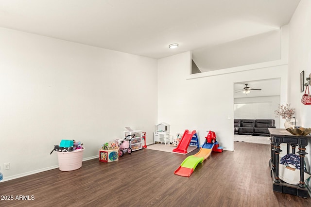 game room featuring ceiling fan and dark hardwood / wood-style flooring