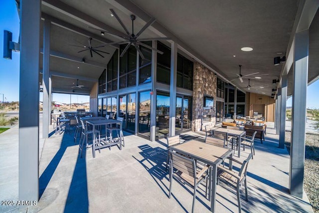 view of patio / terrace featuring outdoor dining space and ceiling fan