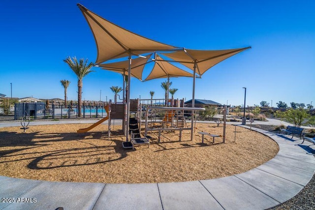 communal playground featuring fence