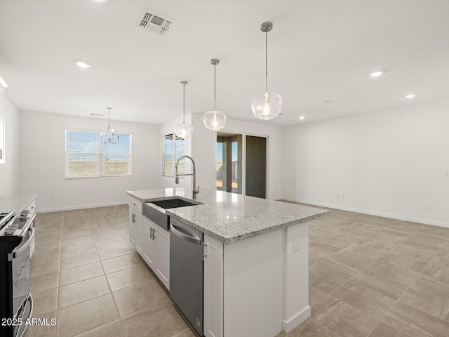 kitchen with stainless steel appliances, a sink, visible vents, white cabinets, and a kitchen island with sink