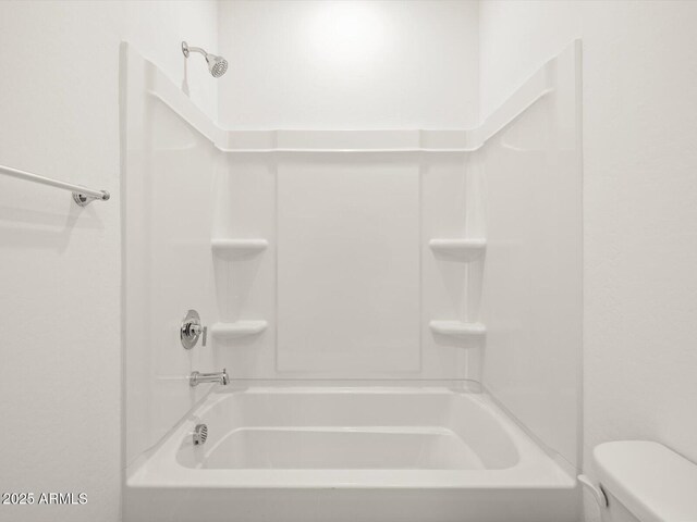 full bath featuring shower / tub combination and toilet