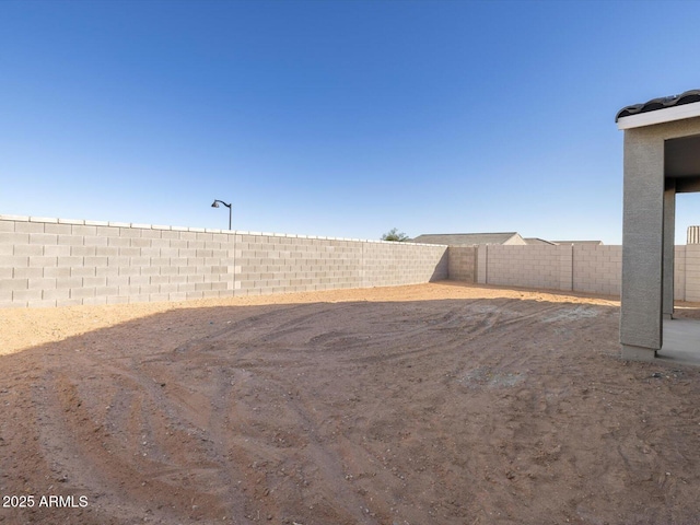 view of yard with a fenced backyard