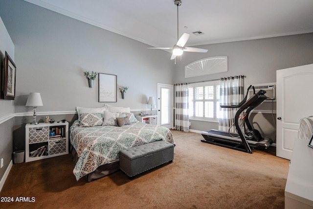 carpeted bedroom with ceiling fan and a high ceiling