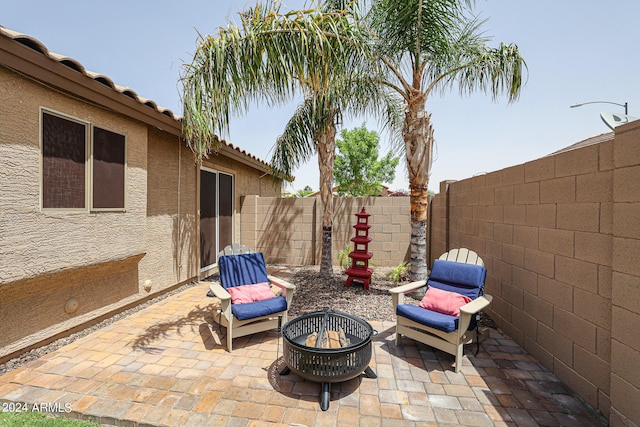 view of patio / terrace with a fire pit