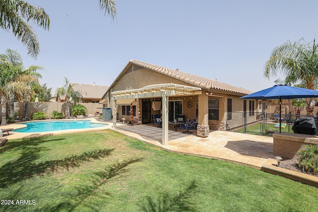 view of swimming pool featuring area for grilling, a patio, and a lawn