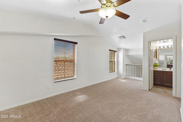 753 N Port Dr, Gilbert, AZ 85233 - empty room with light colored carpet, lofted ceiling, a ceiling fan, and baseboards