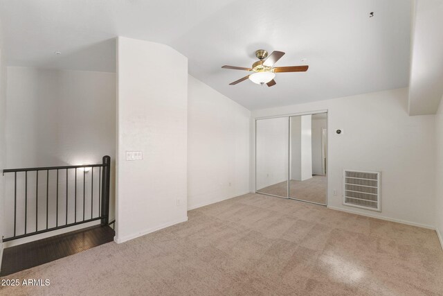 753 N Port Dr, Gilbert, AZ 85233 - unfurnished bedroom with vaulted ceiling, carpet flooring, a closet, and a ceiling fan