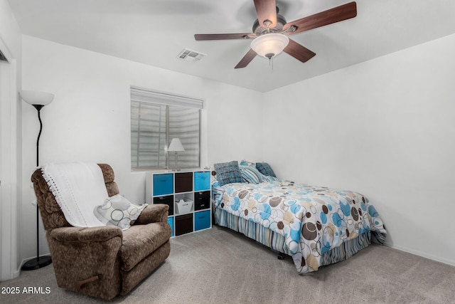 bedroom with carpet, visible vents, and ceiling fan
