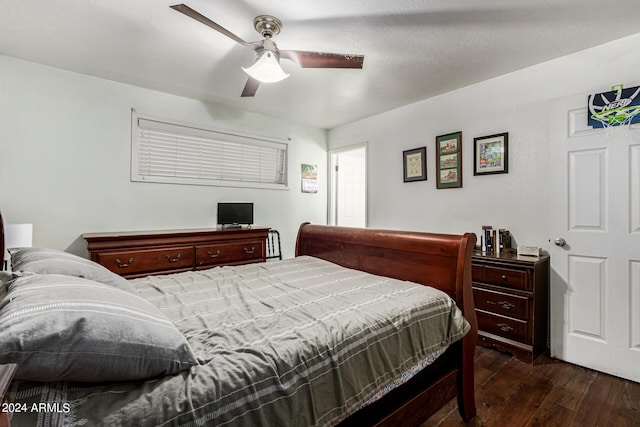 bedroom featuring ceiling fan and dark hardwood / wood-style flooring