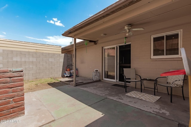 view of patio featuring ceiling fan