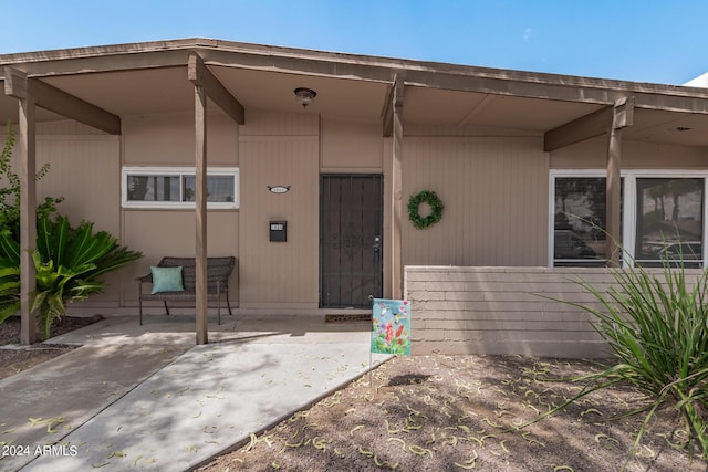 doorway to property featuring a patio area