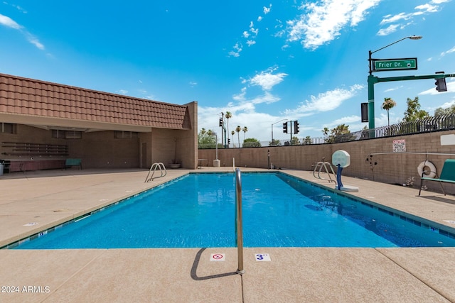 view of swimming pool featuring a patio