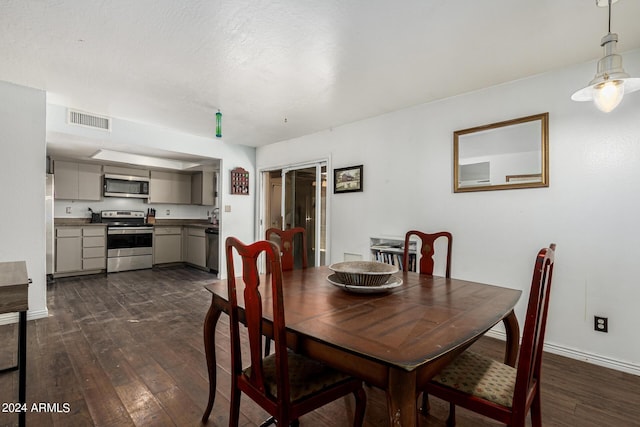 dining room featuring dark wood-type flooring