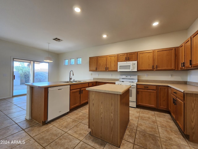 kitchen featuring a center island, hanging light fixtures, white appliances, and sink