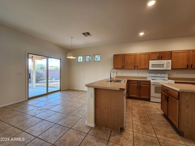 kitchen featuring white appliances, a kitchen island with sink, sink, pendant lighting, and light tile patterned floors