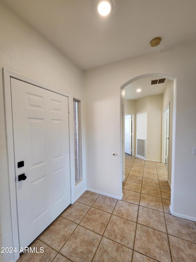 view of tiled foyer entrance