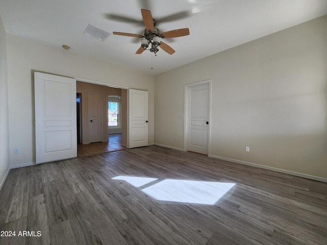 unfurnished bedroom with hardwood / wood-style flooring and ceiling fan