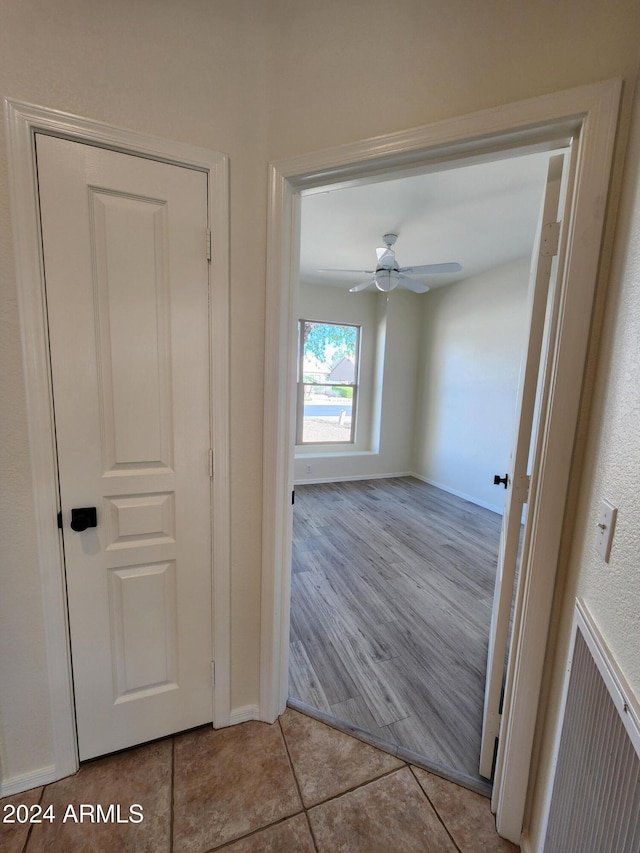 corridor with light wood-type flooring