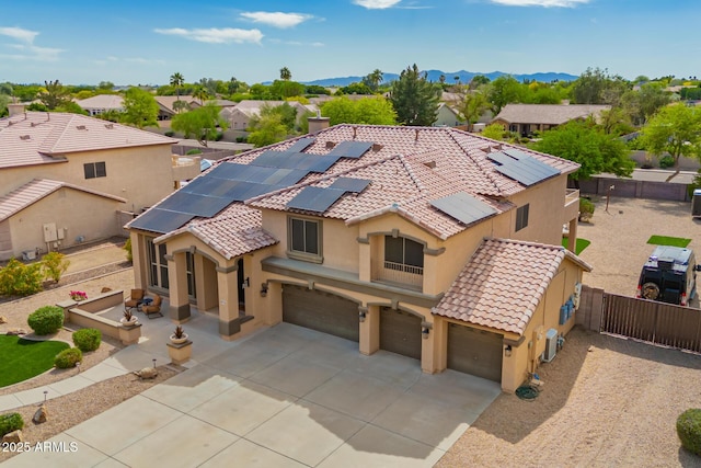 24916 N 80th Ln, Peoria, AZ 85383 - view of front of property with a tiled roof, stucco siding, a garage, a fenced backyard, and driveway