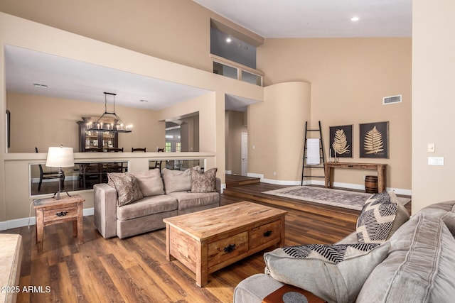 24916 N 80th Ln, Peoria, AZ 85383 - living area with wood finished floors, a chandelier, recessed lighting, and a high ceiling