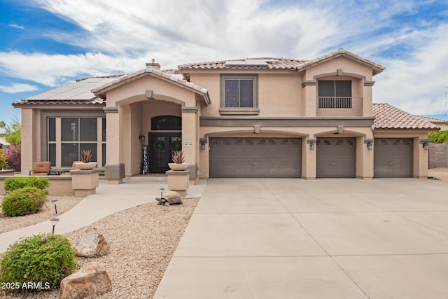 24916 N 80th Ln, Peoria, AZ 85383 - mediterranean / spanish house with solar panels, stucco siding, and an attached garage