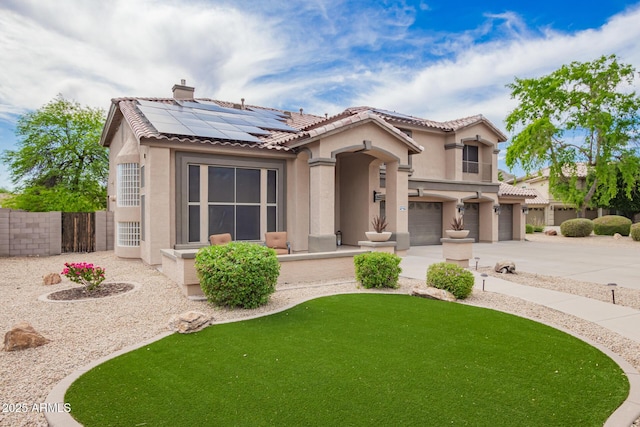 24916 N 80th Ln, Peoria, AZ 85383 - mediterranean / spanish home with stucco siding, a tile roof, a garage, and solar panels