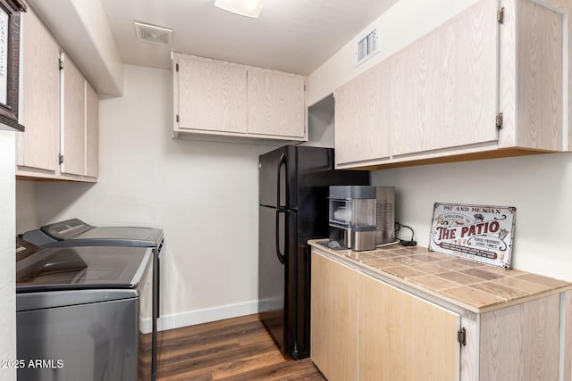 24916 N 80th Ln, Peoria, AZ 85383 - kitchen with tile counters, washing machine and clothes dryer, baseboards, dark wood finished floors, and freestanding refrigerator