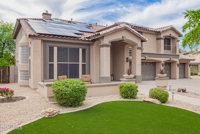 24916 N 80th Ln, Peoria, AZ 85383 - mediterranean / spanish home featuring stucco siding, solar panels, a garage, and a tiled roof