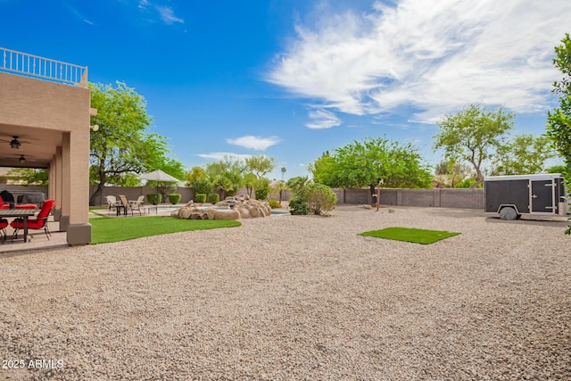 24916 N 80th Ln, Peoria, AZ 85383 - view of yard featuring ceiling fan, fence, a patio, and a balcony