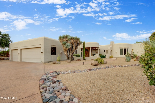 southwest-style home featuring a garage