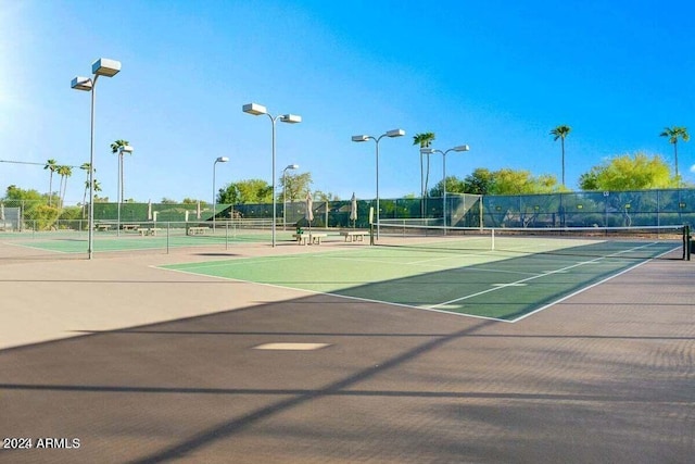 view of tennis court featuring basketball court