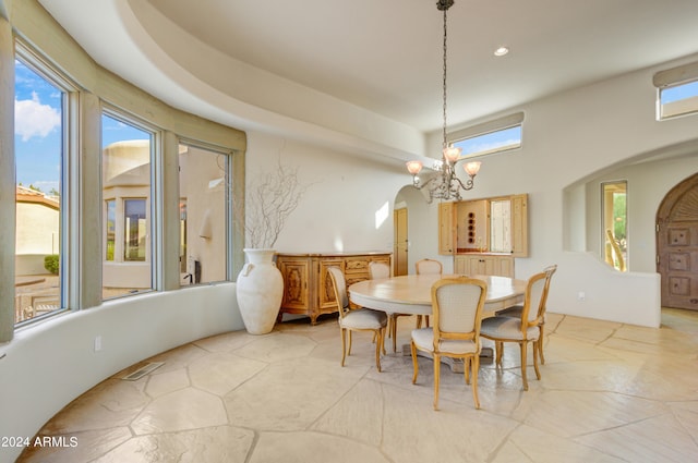 dining area featuring a notable chandelier