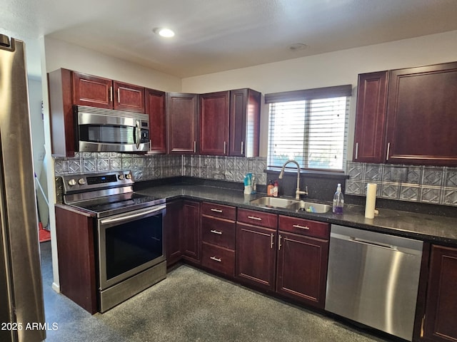 kitchen with stainless steel appliances, tasteful backsplash, and sink