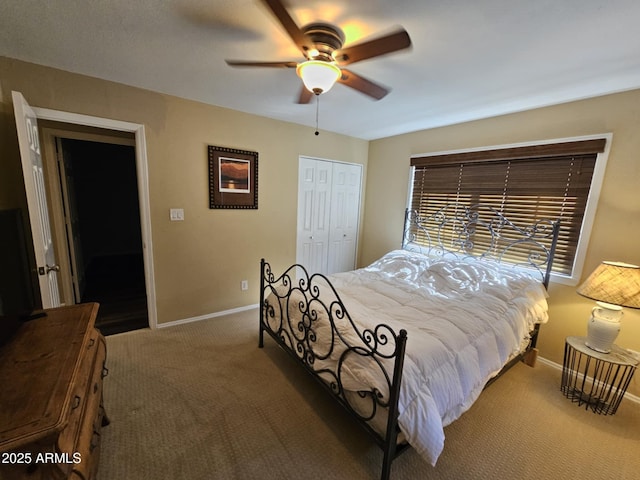 carpeted bedroom featuring a closet and ceiling fan