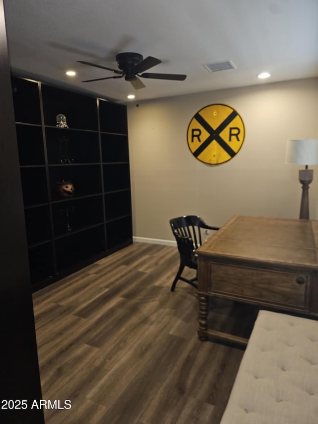 office space with dark wood-type flooring and ceiling fan