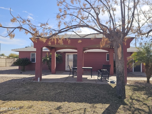 back of house with a patio