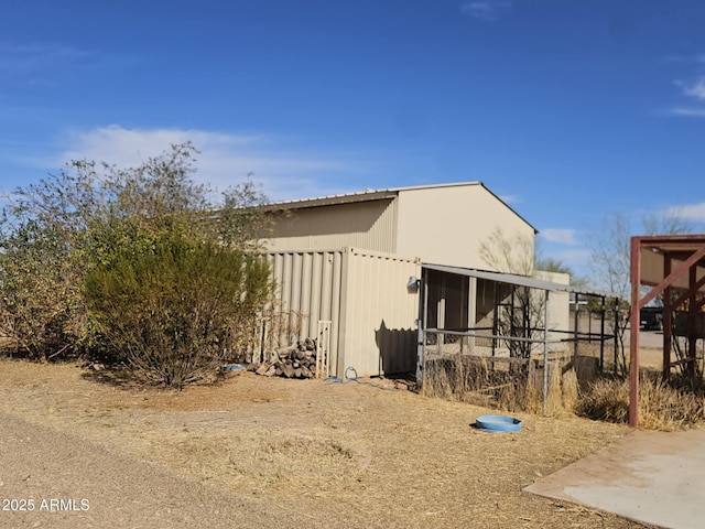 view of home's exterior featuring an outdoor structure