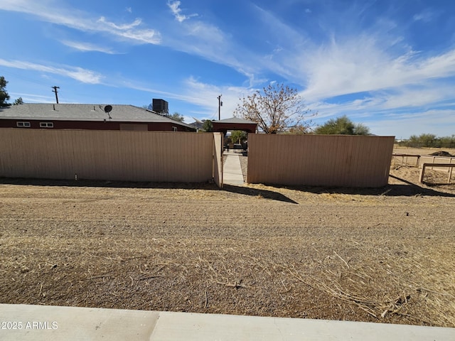 view of yard featuring central air condition unit