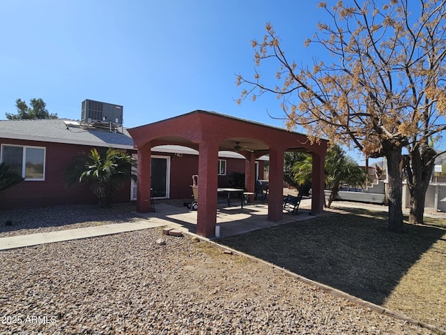 exterior space featuring ceiling fan, a patio area, and central air condition unit