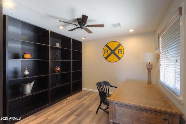 office space with wood-type flooring and ceiling fan